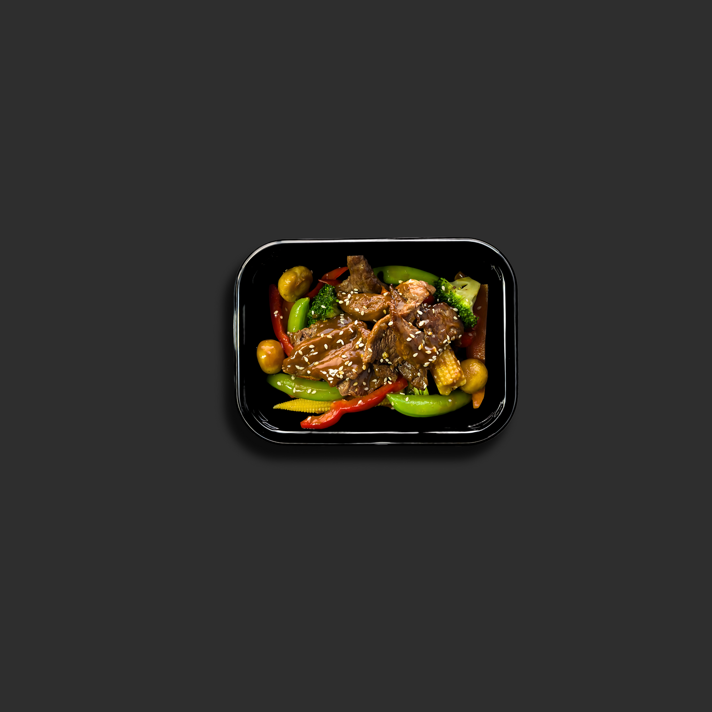 Mongolian Beef Stir Fry with beef, peppers and onions in a black ready meal container