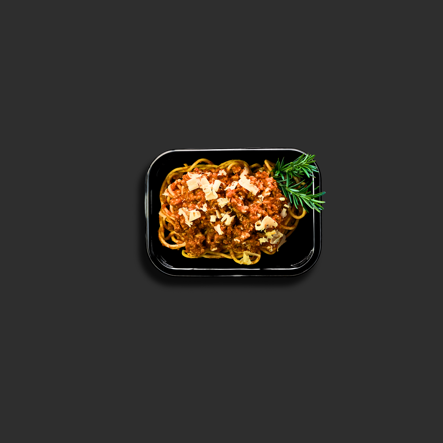 Spaghetti Bolognese served in a black ready meal container , showing the pasta dish with hearty meat sauce and a rosemary garnish in the corner