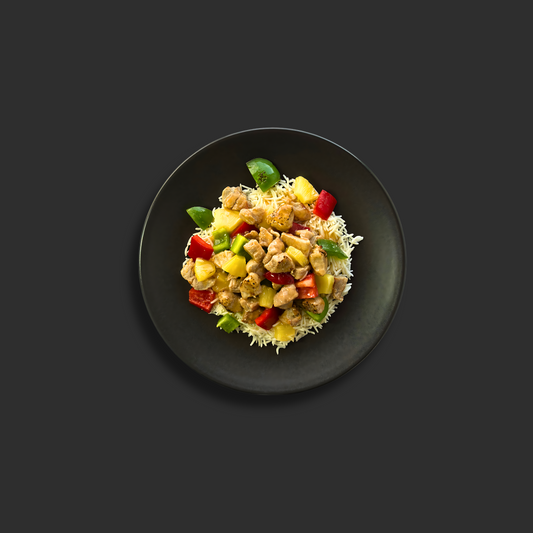 Premium Australian pork tenderloin in vibrant sweet and sour sauce with fresh pineapple, red and green capsicum, served with steamed white rice

